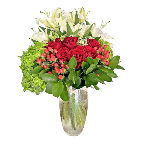 red roses and hypericum in vase