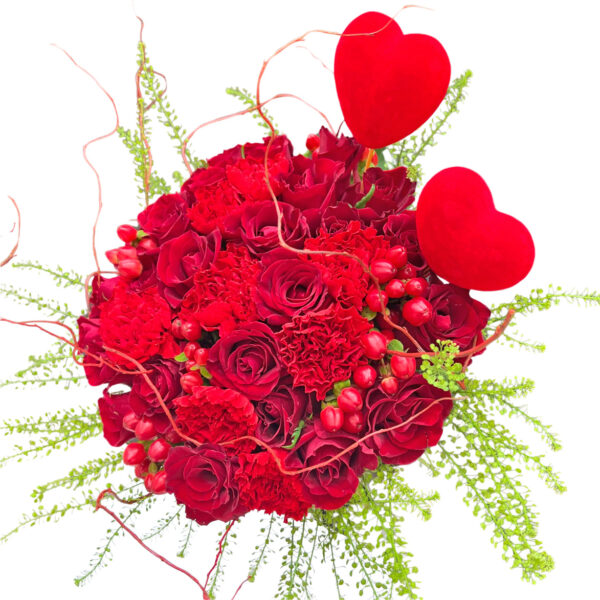 valentines hand bouquet of red flowers and balloons